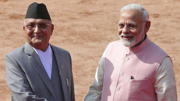 Prime Minister Narendra Modi, right, shakes hand with Nepalese counterpart Khadga Prasad Oli in New Delhi on Saturday.(AP Photo)