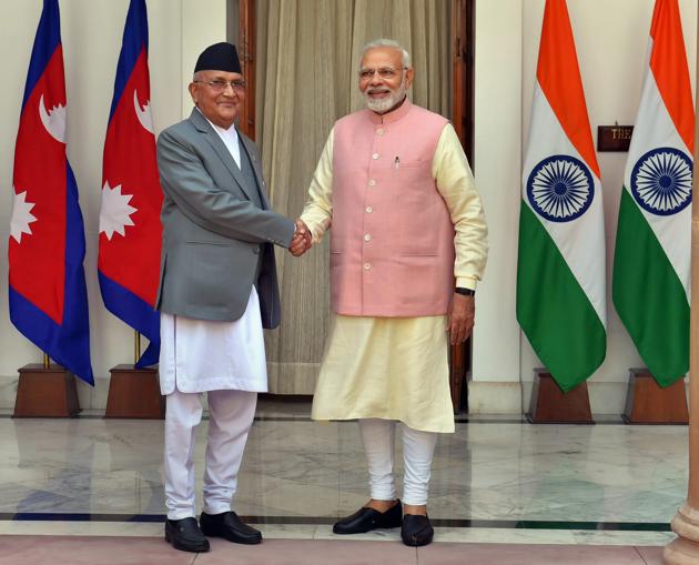 Prime Minister Narendra Modi shakes hands with his Nepalese counterpart Khadga Prasad Oli before their meeting at Hyderabad House in New Delhi on Saturday.(PTI Photo)