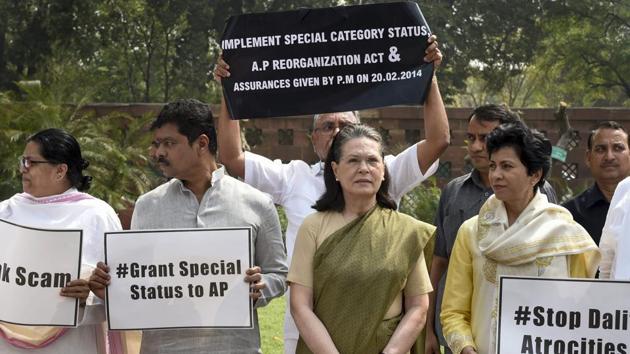 NDA Chairperson Sonia Gandhi stands along with opposition party members during a protest in Parliament during budget session in New Delhi on April 04. Continuous disruptions for 22 days equaled the worst parliamentary logjam of 2010. The Lok Sabha in its 29 sittings lost 127 hours and 45 minutes, working for only 34 hours, 5 minutes. (Kamal Singh / PTI) 