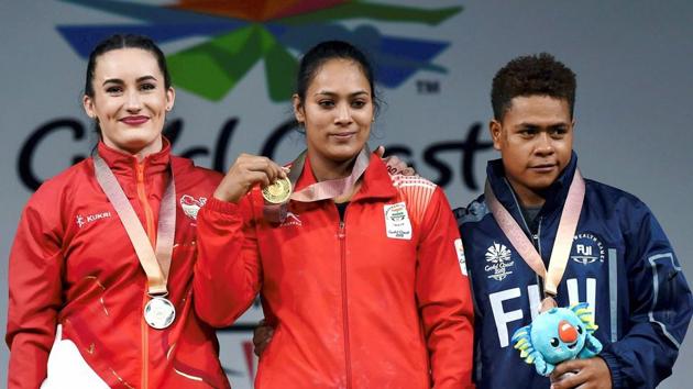 Punam Yadav (C) won the gold medal in women’s 69kg weightlifting. (PTI) Punam Yadav (C) won the gold medal in women’s 69kg weightlifting. (PTI)