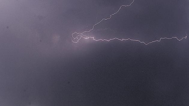A ray of lightning cracks through the cloudy sky in Kharadi on Saturday. (Shankar Narayan/HT PHOTO)