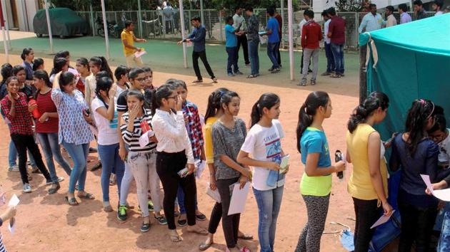 Students go through a security check outside an exam centre for Joint Entrance Examination (JEE) Main 2018 in Bhopal on Sunday. (PTI)