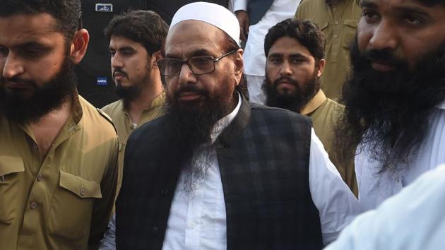 Hafiz Saeed (centre) at a protest rally in Lahore on April 6, 2018. The US declared Saeed’s Jamaat-ud-Dawa (JuD) a foreign terrorist organisation by the US in June 2014.(AFP)
