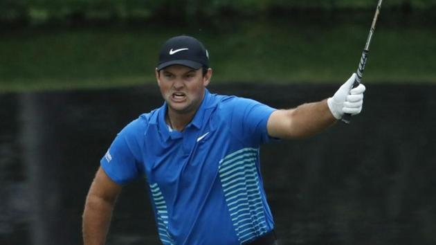 Patrick Reed of the US celebrates chipping in for an eagle on the 15th hole during third round play of the 2018 Augusta Masters golf tournament at the Augusta National Golf Club in Georgia on Saturday.(REUTERS)