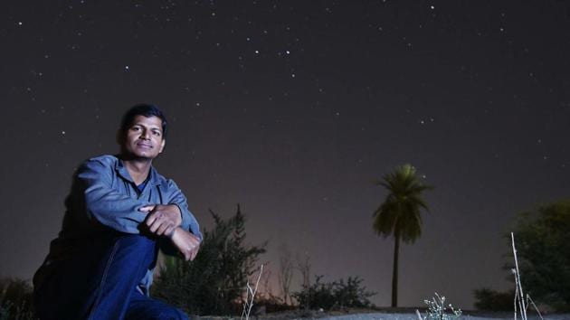 Pradeepta Mohanty, 30, an engineer from Madhya Pradesh, scans footage of space on his laptop and marks objects that could indicate unique galaxies.(Mujeeb Faruqui / HT Photo)