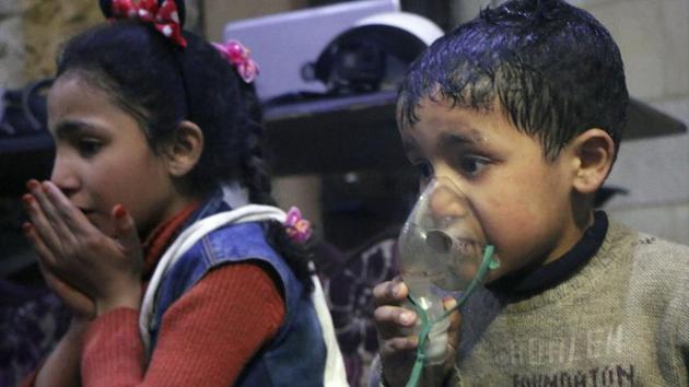 A child receiving oxygen through respirators following an alleged poison gas attack in the rebel-held town of Douma, near Damascus, Syria, on Sunday.(AP photo)