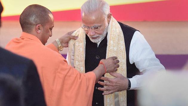 Prime Minister Narendra Modi and Uttar Pradesh chief minister Yogi Adityanath during the inauguration of UP Investors Summit 2018 at Indira Gandhi Prathishthaan in Lucknow on February 21, 2018.(PTI File Photo)