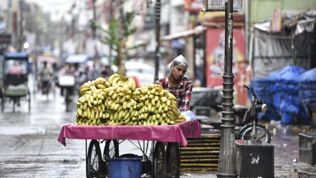 A fruit seller covers his head with plastic while it drizzles in Karol Bagh. Delhi witnessed its first storm of the season on Friday that gave way to a light drizzle, but temperatures were back soaring the next day. (Sanchit Khanna / HT Photo) A fruit seller covers his head with plastic while it drizzles in Karol Bagh. Delhi witnessed its first storm of the season on Friday that gave way to a light drizzle, but temperatures were back soaring the next day. (Sanchit Khanna / HT Photo)