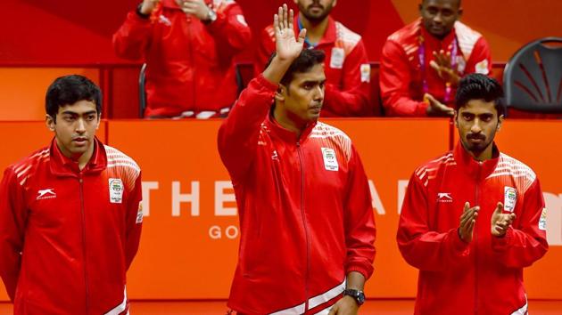 India's Achanta Sharath Kamal (C), Sathiyan Gnanasekaran (R) and Harmeet Desai teamed up to help India secure the men’s team table tennis gold a day after the women’s team won the title. (PTI) India's Achanta Sharath Kamal (C), Sathiyan Gnanasekaran (R) and Harmeet Desai teamed up to help India secure the men’s team table tennis gold a day after the women’s team won the title. (PTI)