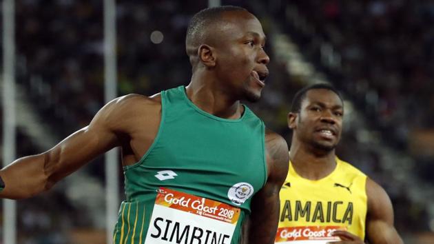 Akani Simbine of South Africa and Yohan Blake of Jamaica during the men’s 100m final at the 2018 Commonwealth Games in gold Coast on Monday.(REUTERS)