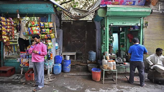 A view of the haveli’s entrance shows its once imposing gate replaced today with a rusting iron-sheet door. The two sides of the haveli, which open into the market’s lanes, now have a row of shops selling sweets and tea, a salon, and two grocery stores. (Anushree Fadnavis / HT Photo) A view of the haveli’s entrance shows its once imposing gate replaced today with a rusting iron-sheet door. The two sides of the haveli, which open into the market’s lanes, now have a row of shops selling sweets and tea, a salon, and two grocery stores. (Anushree Fadnavis / HT Photo)