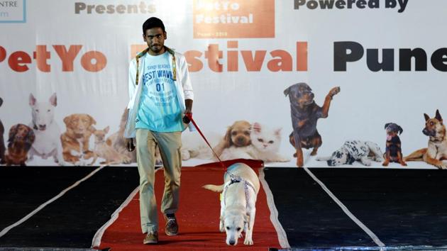 The four-legged friend followed the master on the ramp amidst laughter and excitement at the PetYo festival at Amanora Club House in Pune on April 8. (RAHUL RAUT/HT PHOTO)