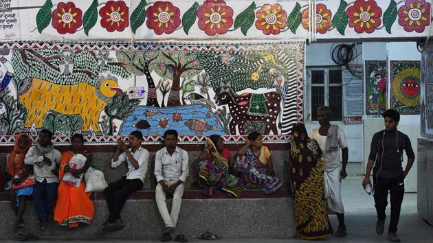 Passengers wait for trains in an area decorated with Mithila wall paintings. Gannath Mishra, a senior railway official supervising the project calls it a world record of sorts with a total wall area of over 14,000 sq ft fully painted under various themes using the region’s traditional Mithila painting style. (Prakash Singh / AFP) Passengers wait for trains in an area decorated with Mithila wall paintings. Gannath Mishra, a senior railway official supervising the project calls it a world record of sorts with a total wall area of over 14,000 sq ft fully painted under various themes using the region’s traditional Mithila painting style. (Prakash Singh / AFP)
