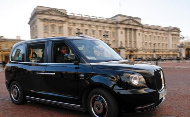 Buckingham Palace (pictured in the background) is the official residence of Queen Elizabeth II although she frequently spends time at her other homes.(Bloomberg/File Photo)