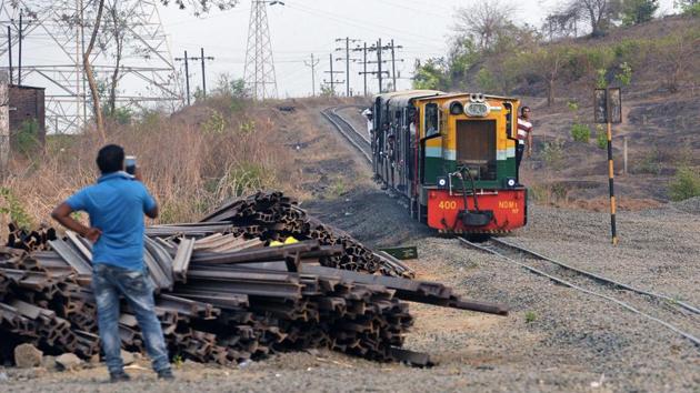 A toy train seen on its return journey from Matheran to Neral. For now, the bogies still have the brake porters, but their role is now ensuring safety, making sure no passengers are standing, leaning or forcing pressure on one side of the bogie. (Pratham Gokhale / HT Photo) 