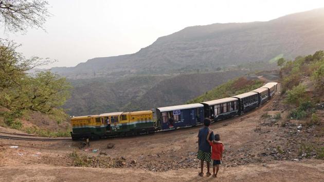 Children look on as a toy train makes its way from Jummapatti. Work is underway on replacing the tracks and putting up safety barriers around the riskier turns and crossings. And keeping with the demand, authorities are looking at increasing services, and also perhaps a dining car. (Pratham Gokhale / HT Photo) 