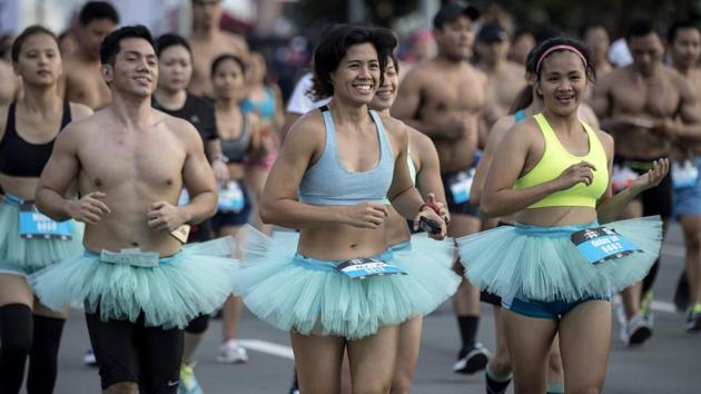 Joggers wearing tutus participate in a fun run wearing only their undergarments in Manila.(AFP)