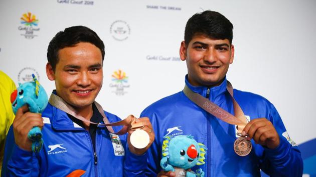 Om Prakash Mitharval (R) finished third in the same event to win bronze on Monday. (AFP) Om Prakash Mitharval (R) finished third in the same event to win bronze on Monday. (AFP)