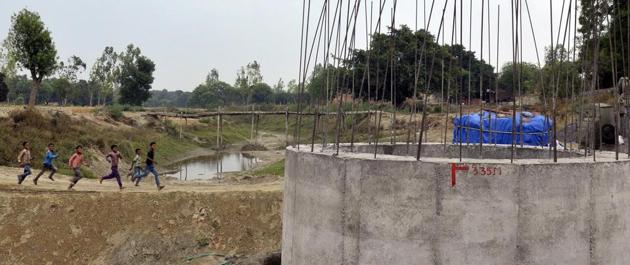 The villagers’ 70 year long struggle for a bridge over Behta mullah finally ended on Monday. A pillar has already been raised for the bridge. (HT Photo) The villagers’ 70 year long struggle for a bridge over Behta mullah finally ended on Monday. A pillar has already been raised for the bridge. (HT Photo)