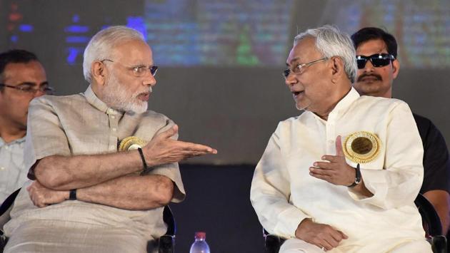 PM Narendra Modi with Bihar CM Nitish Kumar during ‘Satyagrah Se Swachhagrah’ programme on the concluding ceremony of Centenary of Champaran Satyagraha celebration in Motihari, Bihar on Tuesday. Modi also dedicated to the nation the Madhepura electric locomotive facility and flagged off the first engine manufactured there through a remote device from Motihari. (PTI) PM Narendra Modi with Bihar CM Nitish Kumar during ‘Satyagrah Se Swachhagrah’ programme on the concluding ceremony of Centenary of Champaran Satyagraha celebration in Motihari, Bihar on Tuesday. Modi also dedicated to the nation the Madhepura electric locomotive facility and flagged off the first engine manufactured there through a remote device from Motihari. (PTI)