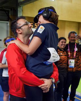 Indian shooter Heena Sidhu celebrates with her husband and coach Ronak Pandit after winning gold in the women’s 25m pistol final event. She picked up India’s third gold medal in shooting and her second medal at the 21st Games breaking a Games record. (Manvender Vashist / PTI) Indian shooter Heena Sidhu celebrates with her husband and coach Ronak Pandit after winning gold in the women’s 25m pistol final event. She picked up India’s third gold medal in shooting and her second medal at the 21st Games breaking a Games record. (Manvender Vashist / PTI)