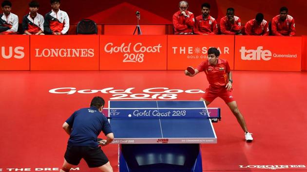 India’s Harmeet Desai returns Singapore’s Ning Gao during their men’s singles table tennis semi-final match on Monday. India blanked Nigeria 3-0 to win the men’s table tennis gold medal at the 2018 Commonwealth Games. (Manvender Vashist / PTI) India’s Harmeet Desai returns Singapore’s Ning Gao during their men’s singles table tennis semi-final match on Monday. India blanked Nigeria 3-0 to win the men’s table tennis gold medal at the 2018 Commonwealth Games. (Manvender Vashist / PTI)