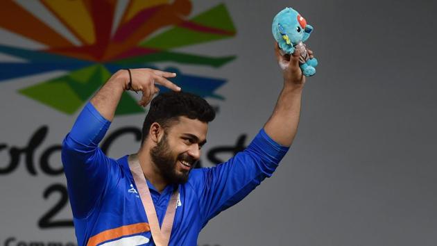Vikas Thakur shows bronze medal during medal ceremony of the men’s 94kg weightlifting category. Thakur added another medal to India’s haul from weightlifting at the 2018 Commonwealth Games in Gold Coast on Sunday. (Manvender Vashist / PTI) Vikas Thakur shows bronze medal during medal ceremony of the men’s 94kg weightlifting category. Thakur added another medal to India’s haul from weightlifting at the 2018 Commonwealth Games in Gold Coast on Sunday. (Manvender Vashist / PTI)