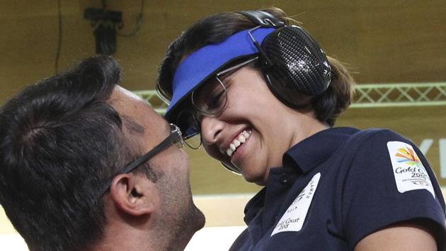 Heena Sidhu (R) celebrates with her husband and coach Ronak Pandit after winning the gold medal during the women's 25m Pistol final at the Belmont Shooting Centre during the 2018 Commonwealth Games in Brisbane. (PTI) Heena Sidhu (R) celebrates with her husband and coach Ronak Pandit after winning the gold medal during the women's 25m Pistol final at the Belmont Shooting Centre during the 2018 Commonwealth Games in Brisbane. (PTI)