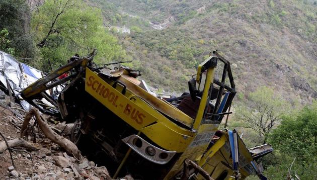 Indian villagers look at a wrecked school bus near Nurpur in Kangra district, Himachal Pradesh, April 10, 2018(AFP) Indian villagers look at a wrecked school bus near Nurpur in Kangra district, Himachal Pradesh, April 10, 2018(AFP)