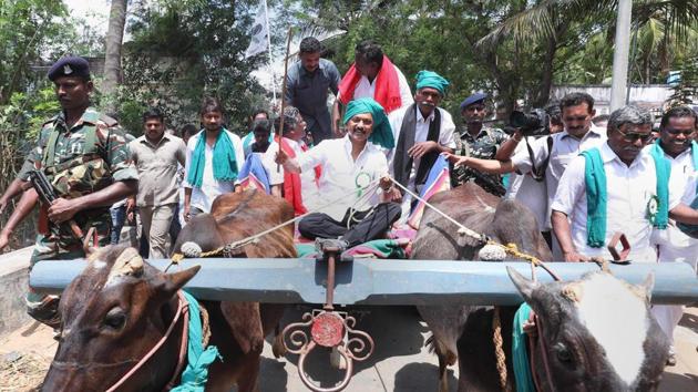 DMK leader MK Stalin rides a bullock cart during a rally, which covers the Cauvery basin region of Tamil Nadu, seeking immediate constitution of a Cauvery Management Board, in Thiruvarur on Tuesday.(PTI)