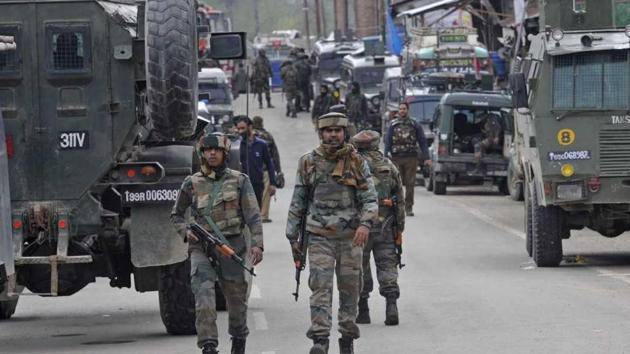 Security personnel patrol the streets following an encounter with militants in Khudwani village, Kulgam district, south Kashmir, on Wednesday. (Waseem Andrabi/HT Photo) Security personnel patrol the streets following an encounter with militants in Khudwani village, Kulgam district, south Kashmir, on Wednesday. (Waseem Andrabi/HT Photo)