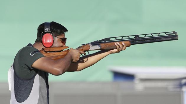 Ankur Mittal of India shoots during the men's Double Trap final at the Belmont Shooting Centre. He finished second. (AP)