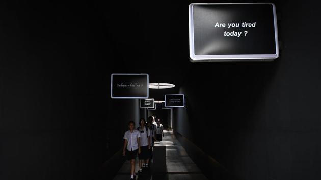 The cafe is not the first to offer a resurrection experience in Thailand, where a temple outside Bangkok is famous for symbolic funerals to rid souls of bad karma. Sitting squarely in the middle of a community centre, the cafe has also spread out to a public walkway, which is posted with signs asking questions like: “What is the purpose of your life?” (Lillian Suwanrumpha / AFP) The cafe is not the first to offer a resurrection experience in Thailand, where a temple outside Bangkok is famous for symbolic funerals to rid souls of bad karma. Sitting squarely in the middle of a community centre, the cafe has also spread out to a public walkway, which is posted with signs asking questions like: “What is the purpose of your life?” (Lillian Suwanrumpha / AFP)