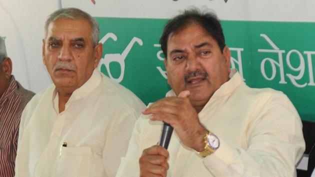 Leader of Opposition in Haryana assembly Abhay Chautala (right) addressing a press conference in Chandigarh on Tuesday as Haryana INLD chief Ashok Arora looks on.(Anil Dayal/HT)