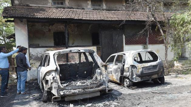 Three men are seen throwing combustible liquid on the car before setting it ablaze in the CCTV footage.(HT PHOTO)