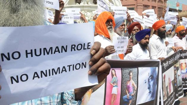 Members of Sikh community hold placards during a protest against the screening of the film 'Nanak Shah Faqir' in Amritsar on April 7.(AFP)