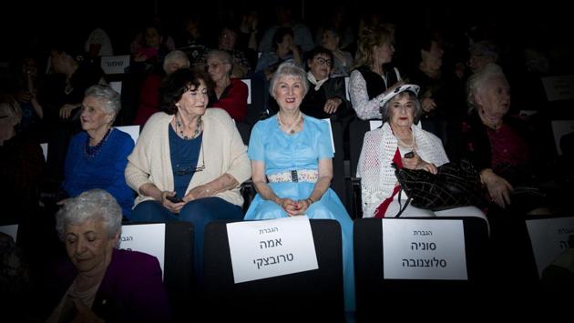 The ‘beauty heroines’ seen all decked up at the commemorative event. Israel observes Yom HaShoah with an air raid siren followed by two minutes of silence in the entire country. Flags are flown at half mast and places of public entertainment are closed by law. (Oded Balilty / AP)