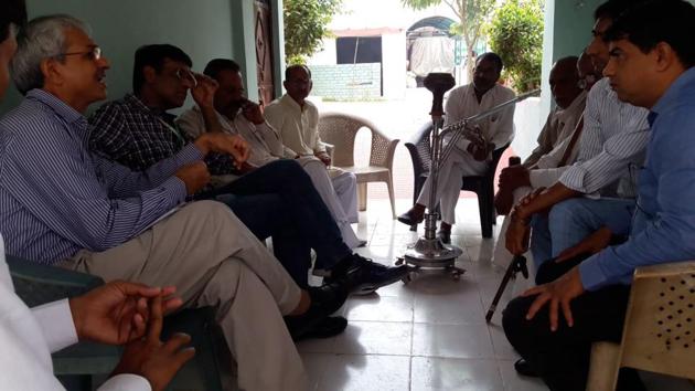 MCG chief medical officer Dr Asrudin speaks with villagers living near the Bandhwari waste treatment. The visit comes a day before the chief minister is due to visit the site. Villagers have planned a protest to draw CM’s attention to the health problems they are facing.