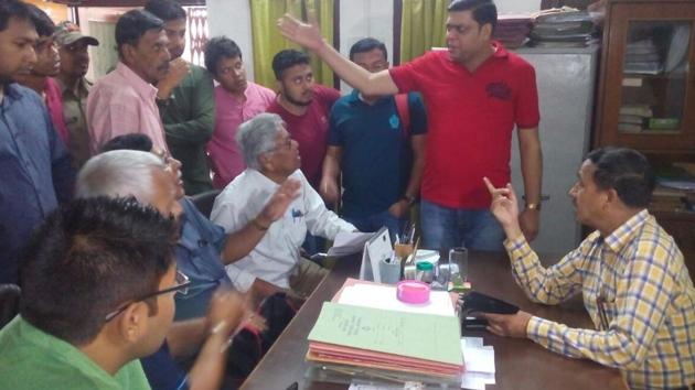 Tourists and protesters in the office of Corbett Park in Ramnagar on Wednesday. (HT Photo)