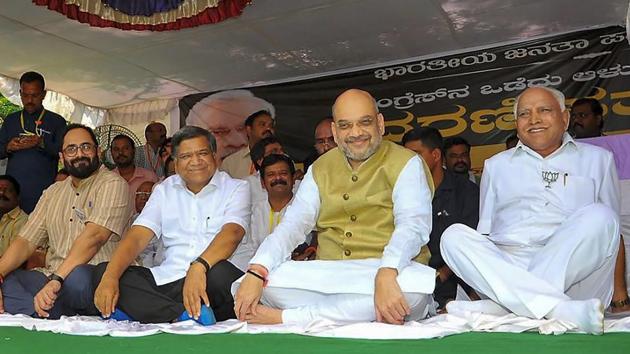 BJP President Amit Shah with party leaders BS Yeddyurappa, Jagadish Shettar and MP Rajeev Chandrasekhar during a day-long fast to protest against the disruption of parliament proceedings by the opposition, in Dharwad, Karnataka. Prime Minister Narendra Modi also held the fast while continuing with official work, including addressing the 10th edition of Defence Expo. (PTI) BJP President Amit Shah with party leaders BS Yeddyurappa, Jagadish Shettar and MP Rajeev Chandrasekhar during a day-long fast to protest against the disruption of parliament proceedings by the opposition, in Dharwad, Karnataka. Prime Minister Narendra Modi also held the fast while continuing with official work, including addressing the 10th edition of Defence Expo. (PTI)