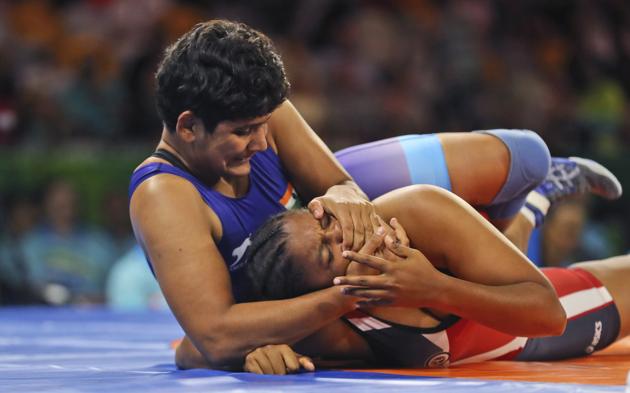India's Kiran wrestles with Mauritius's Katouskia Pariadhaven to win Bronze medal in women's 76kg wrestling. (AP) India's Kiran wrestles with Mauritius's Katouskia Pariadhaven to win Bronze medal in women's 76kg wrestling. (AP)