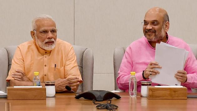 Prime Minister Narendra Modi and BJP president Amit Shah at the party headquarters in New Delhi. (PTI File Photo) Prime Minister Narendra Modi and BJP president Amit Shah at the party headquarters in New Delhi. (PTI File Photo)