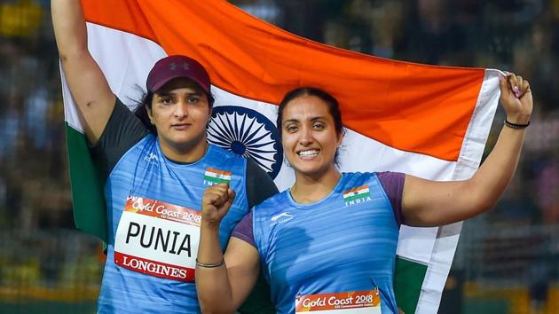 Silver medalist Seema Punia and bronze medalist Navjeet Dhillon of India celebrate their win in the women's discus throw final match at the Commonwealth Games 2018 in Gold Coast, on Thursday.(PTI)