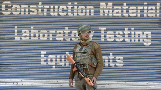 An Indian paramilitary trooper stands guard during a one-day strike, called by the Joint Resistance Leadership (JRL) to protest against the killings of four youths in Kashmir, in Srinagar. The police said restrictions were imposed in Srinagar’s old city and also in the uptown areas falling under the jurisdiction of Maisuma and Kralkhud police stations. (Tauseef Mustafa / AFP) An Indian paramilitary trooper stands guard during a one-day strike, called by the Joint Resistance Leadership (JRL) to protest against the killings of four youths in Kashmir, in Srinagar. The police said restrictions were imposed in Srinagar’s old city and also in the uptown areas falling under the jurisdiction of Maisuma and Kralkhud police stations. (Tauseef Mustafa / AFP)