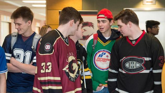 Students at Citadel High School wear sports jerseys to honor the victims of the Humboldt Broncos hockey team in Halifax on Thursday, April 12. A bus carrying the hockey team crashed into a truck killing several and injuring others last Friday.(AP/ The Canadian Press)