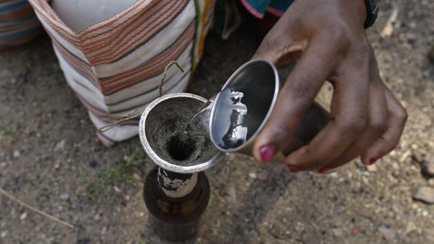 Mahua is an almost clear liquid with a hint of cloudiness. Its primary ingredient found in abundance, this crowd favourite is made easily in home distilleries and quite inexpensive for those buying it. (Sanchit Khanna / HT Photo)