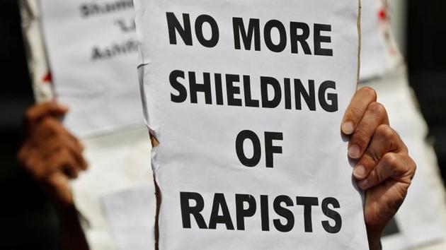 People hold placards to protest the rape and murder of an eight-year-old girl in Kathua (Jammu) and the rape of an Unnao teenager in Uttar Pradesh, in New Delhi on April 12, 2018. (Reuters) People hold placards to protest the rape and murder of an eight-year-old girl in Kathua (Jammu) and the rape of an Unnao teenager in Uttar Pradesh, in New Delhi on April 12, 2018. (Reuters)