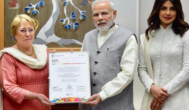 Priyanka Chopra meets Narendra Modi and is dressed in a traditional salwar suit.