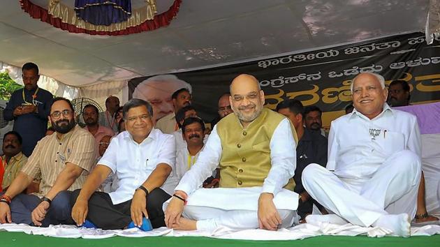 BJP President Amit Shah with party leaders BS Yeddyurappa, Jagadish Shettar and MP Rajeev Chandrasekhar during a day-long fast to protest against the disruption of parliament proceedings by the opposition, in Dharwad, Karnataka on Thursday. (PTI) BJP President Amit Shah with party leaders BS Yeddyurappa, Jagadish Shettar and MP Rajeev Chandrasekhar during a day-long fast to protest against the disruption of parliament proceedings by the opposition, in Dharwad, Karnataka on Thursday. (PTI)
