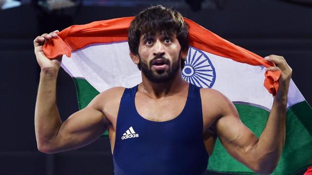 Bajrang Punia celebrates after defeating Wales’ Kane Charig to win gold in men's freestyle 65 kg wrestling event, at the Commonwealth Games 2018 in Gold Coast. Anish Bhanwala, also won a gold medal in the 25m rapid fire pistol final, and has become India’s youngest ever gold medallist at the Commonwealth Games. (Manvender Vashist / PTI) Bajrang Punia celebrates after defeating Wales’ Kane Charig to win gold in men's freestyle 65 kg wrestling event, at the Commonwealth Games 2018 in Gold Coast. Anish Bhanwala, also won a gold medal in the 25m rapid fire pistol final, and has become India’s youngest ever gold medallist at the Commonwealth Games. (Manvender Vashist / PTI)